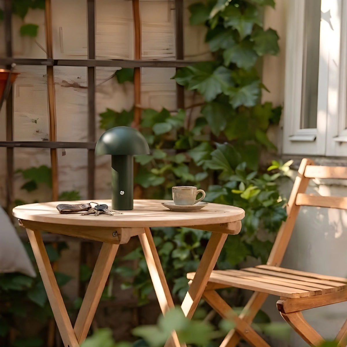 Dario Portable Table Lamp in green, featuring a rechargeable and cordless design, perfect for indoor and outdoor use. 1