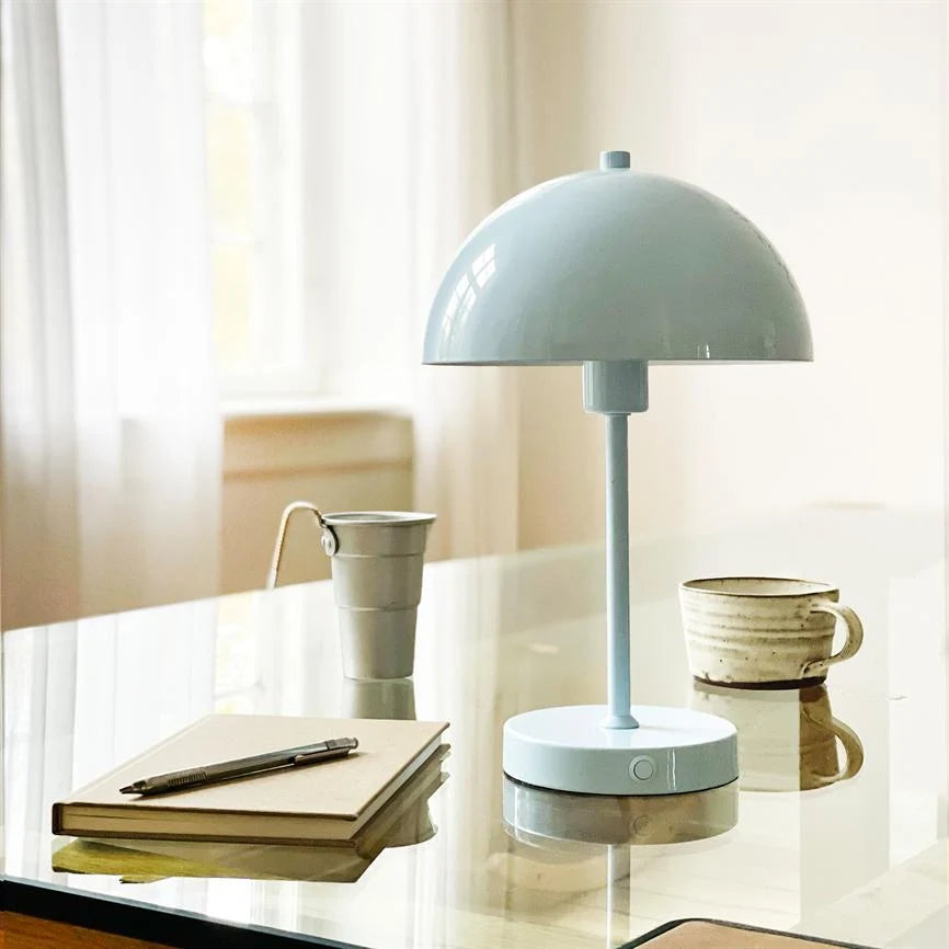 Solea LED Table Lamp featuring a sleek design, rechargeable cordless functionality, and adjustable brightness settings for versatile lighting solutions. 1