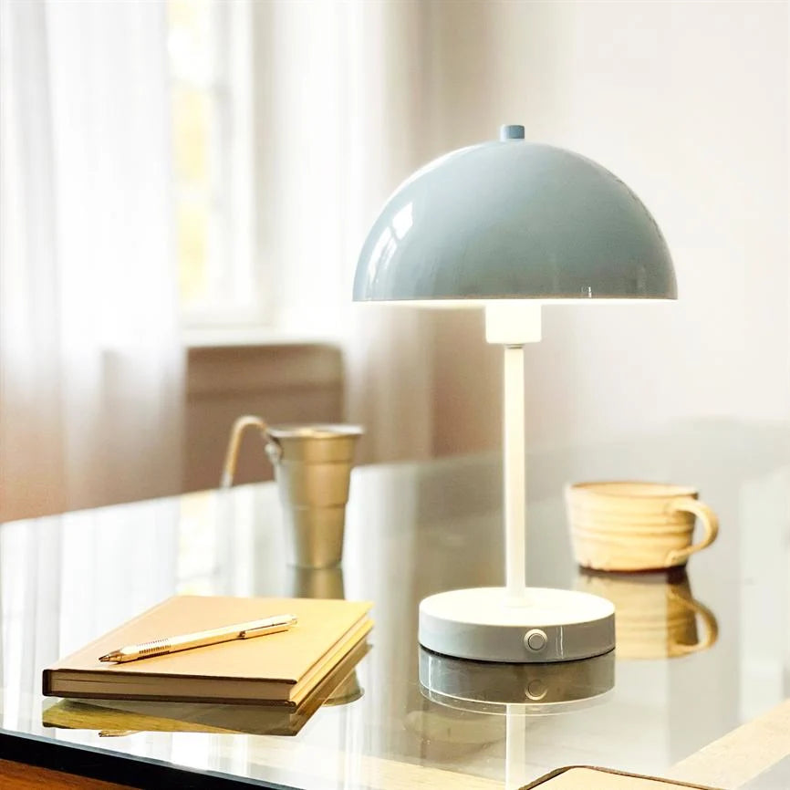 Solea LED Table Lamp featuring a sleek design, rechargeable cordless functionality, and adjustable brightness settings for versatile lighting solutions. 4