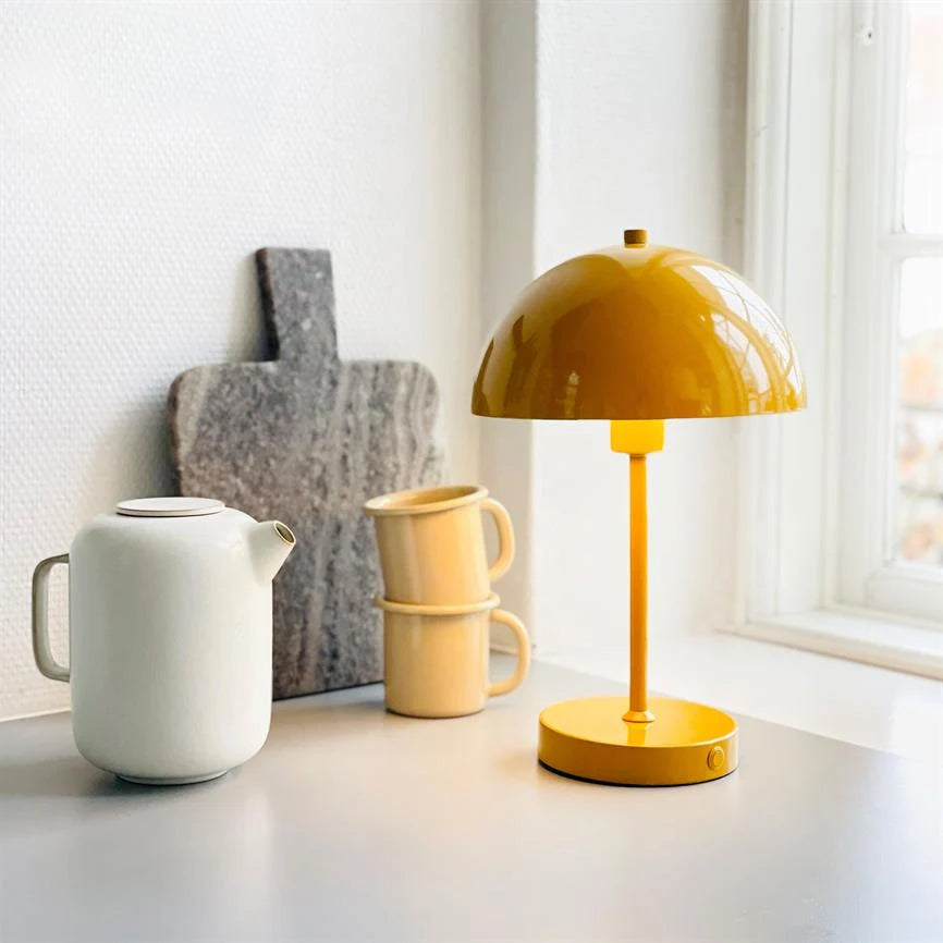 Soren Table Lamp in warm curry color, featuring a rechargeable cordless design and adjustable brightness settings, perfect for adding ambient lighting to any space. 2