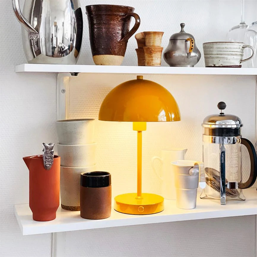 Soren Table Lamp in warm curry color, featuring a rechargeable cordless design and adjustable brightness settings, perfect for adding ambient lighting to any space. 3